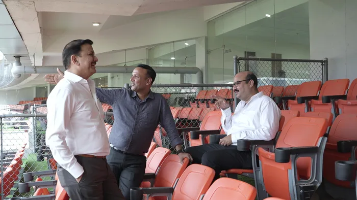 KTP Group leaders share a moment in the stands